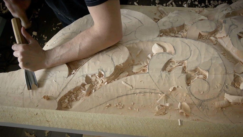 In this woodcarving lesson video, Alexander Grabovetskiy instructs on the intricacies of Baroque style wood carving in Venetian overhead room sections, while emphasizing the importance of traditional, classical wood carving techniques. Wood Carving Course online - Carving Authentic Venice 15th Century room. It is all about being authentic to the original 15th-century wood carving. wood carving course wood carving courses decoy carving classes woodworking school cabinet making school wood carving supplies wood carving class wood carving school wood carving schools wood carving courses for beginners wood carving videos free wood carving lessons near me wood carving classes online wood carving schools wood carving workshops wood carving programs wood carving online shop Woodcarving, Wood Carving, Woodcarving School, School of Woodcarving, School of Wood Carving wood carving course wood carving courses decoy carving classes woodworking school cabinet making school wood carving supplies wood carving class wood carving school wood carving schools wood carving courses for beginners wood carving videos free wood carving lessons near me wood carving classes online wood carving schools wood carving workshops wood carving programs wood carving online shop https://www.instagram.com/woodcarvergrabovetskiy/ Design for Wood Carving is not the same as for Fine art or even Sculpture. Fine art is 2D World vs Sculpture and Wood carving is 3D world. Wood Carving is also a type of Sculpture. But if You compare a Clay Modeling and Wood Carving. Modeling clay is the art of ADDING ON and Wood Carving is an Art of DEDUCTION. And art of deduction is a little more complicating. You can deduct with Your Carving tool just a 1/16” too much and Your work is "gone with the wind”. To Design for wood carving We need to Think a little different. And the same questions should be always in our heads- What tools do I have and how I will carve what I am designing? How deep can my tool travel inside of my piece of wood and how it will turn. Design for Wood Carving is a science and it is based on a laws. During this Class we will discover some of the laws or Principles and answer a really important Design questions. The Law of Space. - How to emphasize parts of a Design - "The Big Idea" position in Space The Law of Main Movement - How to be "on the same page" with Human Brain. Baroque diagonal vs Sinister diagonal in Artistic Design. The Law of Armature- How to Structure over all Design and be “Kosher” (clean) in it. The Law of Golden Ratio - How to implement Fibonacci Sequence - the Art Secret for Pleasing Human eye The Law of Arabesque - How to implement Natural Flowing Movements in Design The Law of Rhythm in Design. How to apply what is known to Music world to Design for Wood Carving. Wood Carving Lessons Best Wood Carver in the World Wood Carving Master Classes Wood Carving Courses