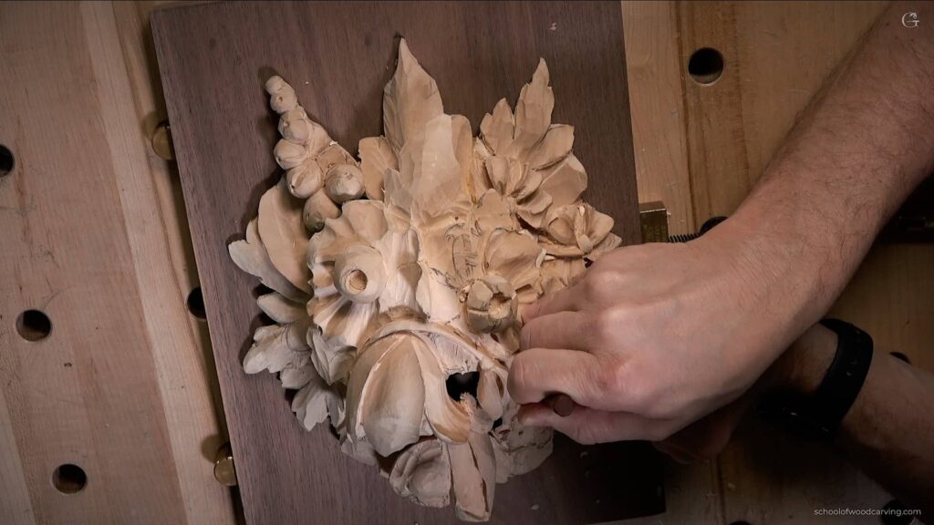 Highly detailed carved wooden panel featuring flora and fauna in Grinling Gibbons style. Take a deep dive into the traditional art of wood carving with The School of Wood Carving. Led by Alexander Grabovetskiy, one of the world's leading experts in Grinling Gibbons-style wood carving, this course will provide you with the tools and techniques to create beautiful, intricate floral designs like those crafted by the masters of the 17th and 18th centuries. In Video Lesson 12-3, you will learn how to carve in Grinling Gibbons style, from selecting the right wood to establishing the correct proportions and details. You'll gain valuable insight into the history and context of the craft