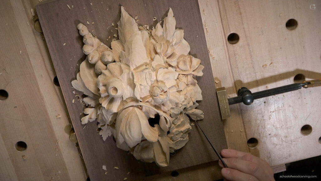 Alexander Grabovetskiy is carving a Wall art decoration for Wood Carving lesson based on Grinling Gibbons style of Wood carving. Alexander Grabovetskiy is a master woodcarver and in this woodcarving lesson, he teaches the techniques needed to carve a beautiful wall decor based on the style of the famous woodcarver Grinling Gibbons. Learn how to carve flowers, leaves, and other details using Grinling Gibbons's unique style of wood carving and create a beautiful, one of a kind wall decoration.