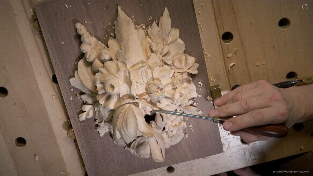 Alexander Grabovetskiy, a master woodcarver, is teaching a woodcarving lesson on creating a wall art decoration in the style of Grinling Gibbons. The lesson will cover techniques for carving flowers, leaves, and other details in Grinling Gibbons' unique style. The end result will be a beautiful, one-of-a-kind wall decoration.