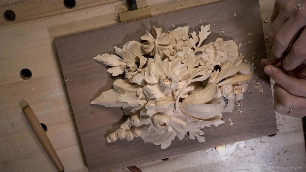 Join master woodcarver Alexander Grabovetskiy in a lesson on creating a wall decor in the style of Grinling Gibbons. Learn the art of carving flowers, leaves, and other details in this unique style and create a beautiful wall decoration.