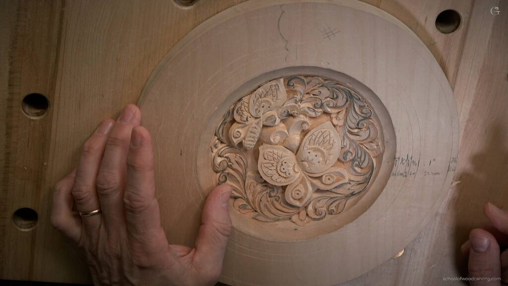 Alexander Grabovetskiy is demonstrating how to create intricate cuts on a butterfly using a knife. He uses an outline to guide his cuts and shows how to create slanting cuts to add depth and shadow. He also demonstrates how to make small plug cuts to create texture and how to blend cuts to create a smooth finish. He emphasizes taking one's time and being careful not to make cuts too deep. The final result is two butterflies with intricate designs. An artist meticulously carves a butterfly on a wooden plate with a carving knife. The process requires patience, precision, and skill to create the intricate details of the butterfly's wings and antennae. The resulting piece of wall art is a breathtaking butterfly decoration that showcases the artist's expertise in wood carving. Want to know how to carve butterflies? This guide will teach you the intricate techniques needed to create beautiful wood carvings with 10th century European style