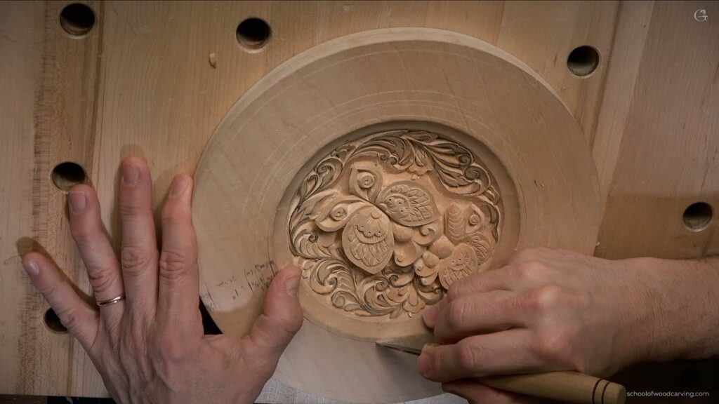 Watch as Alexander Grabovetskiy demonstrates the art of crafting intricate cuts on a butterfly design using a carving knife. Guided by an outline, he showcases slanting cuts for depth and shadow, small plug cuts for texture, and blending cuts for a smooth finish. Patience and precision are key, ensuring cuts are not too deep. The outcome: two beautifully carved butterflies, rich in detail.