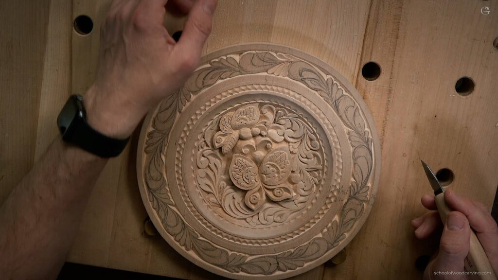 Intricately carved butterflies adorn this stunning wooden plate by Alexander Grabovetskiy.