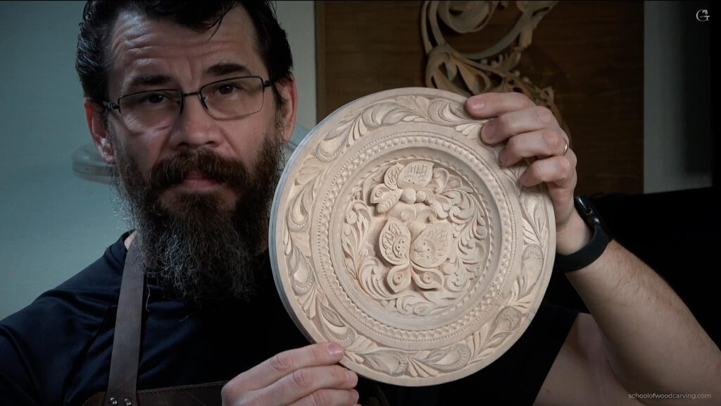 A masterfully carved butterfly plate showcasing the delicate art of wood carving.