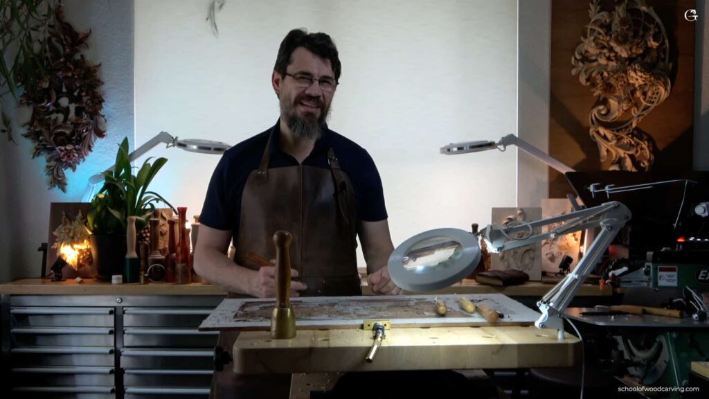 A highly focused woodworker expertly carving intricate designs into a piece of Walnut.