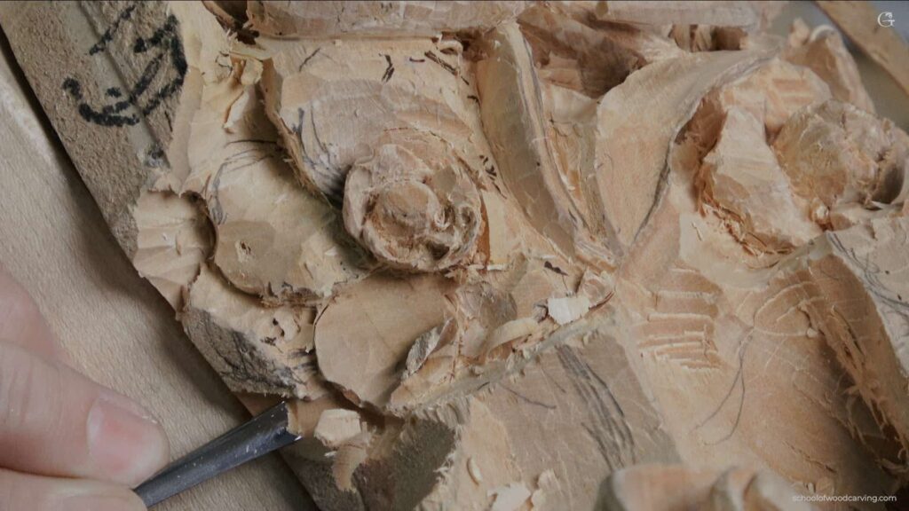 A detailed image of a hand skillfully working on a woodcarving piece. The artisan's focus is evident as they use a sharp, specialized tool to intricately shape the wood. The tool's metal edge glimmers as it smoothly slices through the wood, revealing the underlying beauty of the material. The woodcarving in progress is a fascinating blend of organic form and human creativity. Each chip removed from the woodcarving discloses more of the envisioned design, transforming a simple piece of wood into a work of art. The grain of the woodcarving adds texture and depth to the image, giving it an almost tactile sense as if you could reach out and feel the smooth wood under your fingertips. Shavings from the woodcarving scatter around the workspace, a testament to the labor and dedication poured into this creation. The artist's hand, guiding the tool with precision, shows years of experience in woodcarving. The attention to detail and patience necessary for such a craft are admirable and evident in every cut made into the woodcarving. The background of the image is a blur, keeping the viewer's attention on the woodcarving. It's an intimate look into the artistic process, highlighting not just the final product but the journey of creating a woodcarving. The light in the image illuminates the woodcarving, making the rich hues of the wood stand out. It also casts small shadows, adding depth to the woodcarving and enhancing its three-dimensional effect. This image encapsulates the beauty of woodcarving - a blend of nature's gifts and human ingenuity, transforming a simple piece of wood into something truly beautiful.