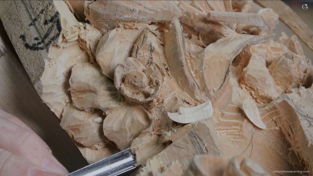 Alexander Grabovetskiy -Woodcarver- engaged in woodcarving, carving a detailed gardenia flower. Dedicated artist focusing on woodcarving, using a carving gouge on a piece of wood. Intricate woodcarving process of transforming a simple wood piece into a gardenia flower. Master in woodcarving showcasing his talent by carving a gardenia flower. Delicate art of woodcarving, carving a beautiful gardenia from a chunk of wood. Exceptional woodcarving skills displayed through the crafting of a gardenia flower. The beauty of woodcarving, exemplified in a hand-carved gardenia flower. The fine art of woodcarving, meticulously carving a floral design. Celebrating the ancient craft of woodcarving with a beautifully carved gardenia. A snapshot of an artisan's dedication to woodcarving, crafting a botanical masterpiece. The essence of woodcarving captured in the creation of a stunning gardenia. The artistry in woodcarving portrayed through the intricate details of a carved gardenia.