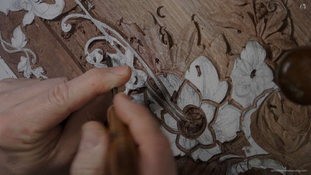 A person is using a tool to paint a piece of wood.
