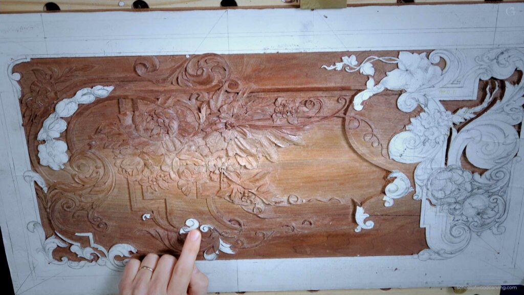 Carving intricate floral patterns into wood.